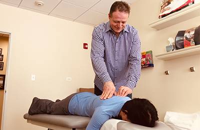 Chiropractor Park Ridge IL Scott Cabrera Adjusting Patient